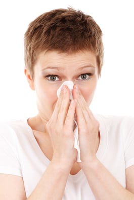 Woman_with_tissues_sneeze.jpg